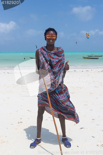 Image of Traditonaly dressed black man on Paje beach, Zanzibar.