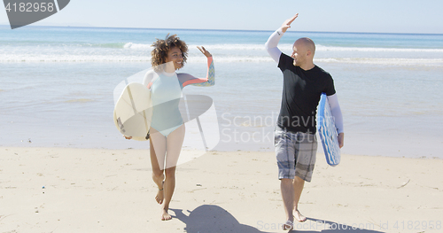 Image of People cheering each other on beach