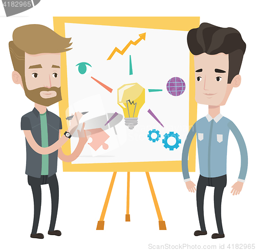 Image of Two businessmen discussing project near board.