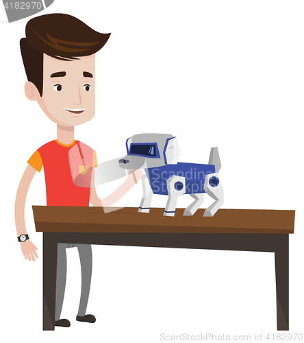 Image of Happy young man playing with robotic dog.