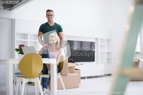 Image of Young couple moving in a new home