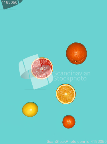 Image of The group fresh fruits against blue background