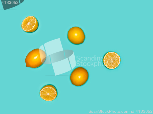 Image of The fresh lemons on blue background