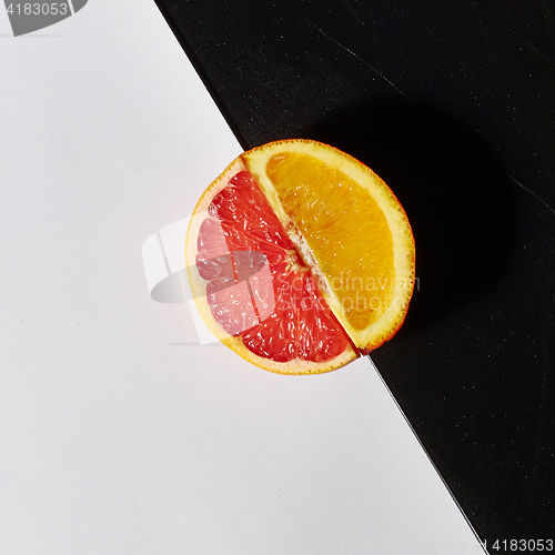 Image of Grapefruit and orange citrus fruit halves