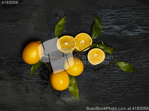 Image of The fresh lemons on black background