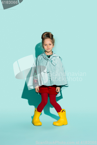 Image of Little girl posing in fashion style wearing autumn clothing.