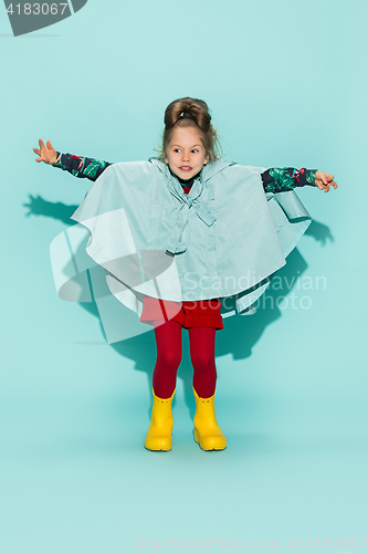 Image of Little girl posing in fashion style wearing autumn clothing.