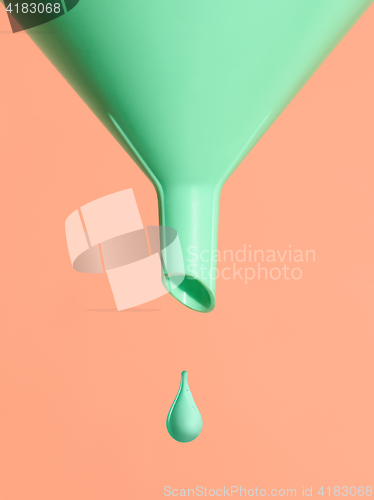 Image of The green Funnel isolated on pink background