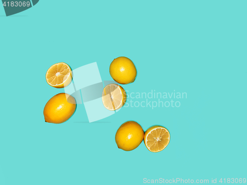 Image of The fresh lemons on blue background