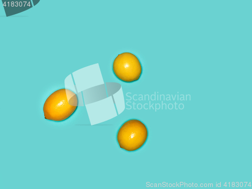 Image of The fresh lemons on blue background