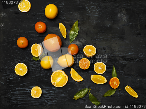 Image of The group fresh fruits against black background