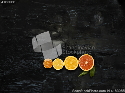 Image of The group fresh fruits against black background