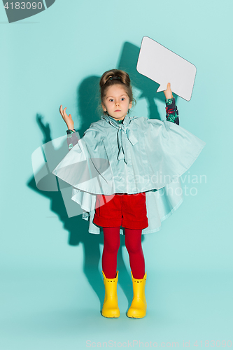 Image of Little girl posing in fashion style wearing autumn clothing.