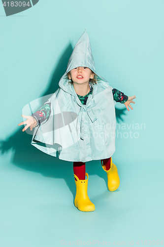 Image of Little girl posing in fashion style wearing autumn clothing.