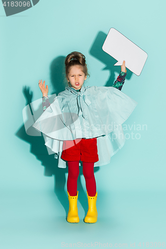 Image of Little girl posing in fashion style wearing autumn clothing.