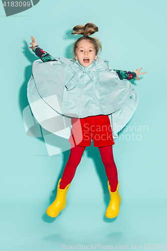 Image of Little girl posing in fashion style wearing autumn clothing.