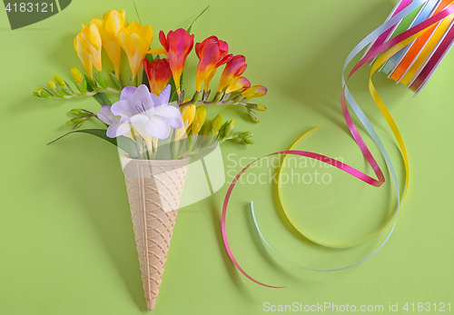 Image of Freesias flowers in ice cream waffles