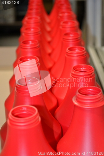 Image of Red plastic bottles