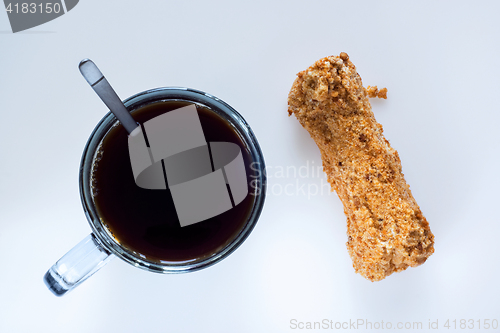 Image of Coffee and eclair, top view