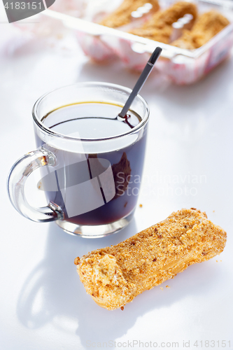 Image of Black Coffee with eclairs