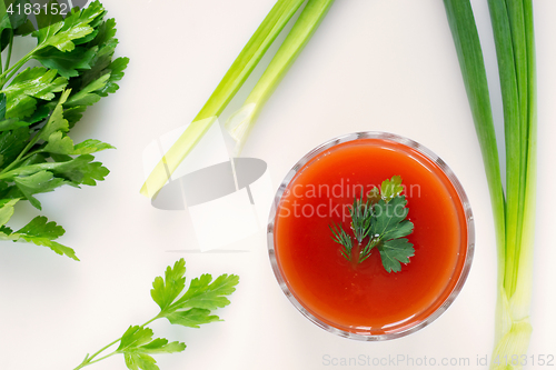 Image of Tomato juice and greens, top view