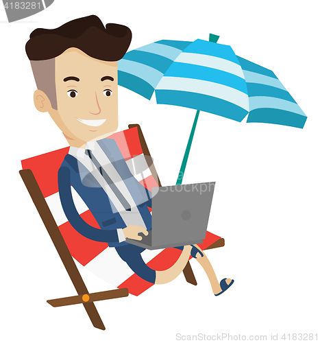 Image of Businessman working with laptop on the beach.