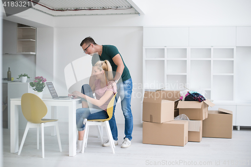 Image of Young couple moving in a new home