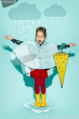 Image of Little girl posing in fashion style wearing autumn clothing.