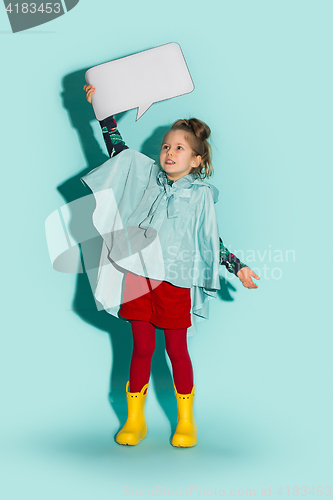 Image of Little girl posing in fashion style wearing autumn clothing.