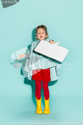 Image of Little girl posing in fashion style wearing autumn clothing.