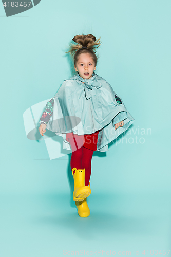 Image of Little girl posing in fashion style wearing autumn clothing.