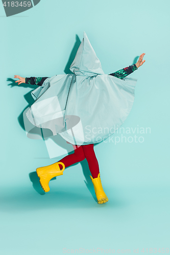 Image of Little girl posing in fashion style wearing autumn clothing.