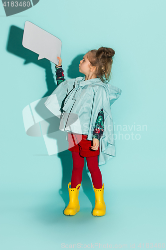 Image of Little girl posing in fashion style wearing autumn clothing.