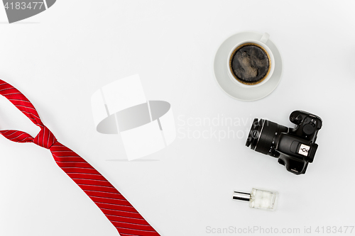 Image of Coffee and personal items on desktop