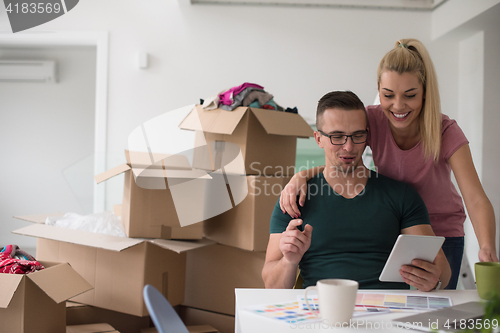 Image of Young couple moving in a new home