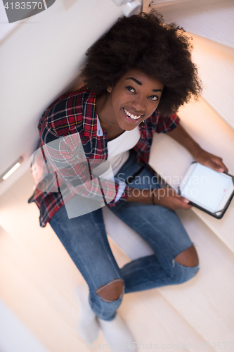 Image of black woman using her electronic tablet