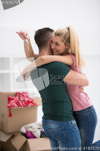 Image of happy Young couple moving in new house