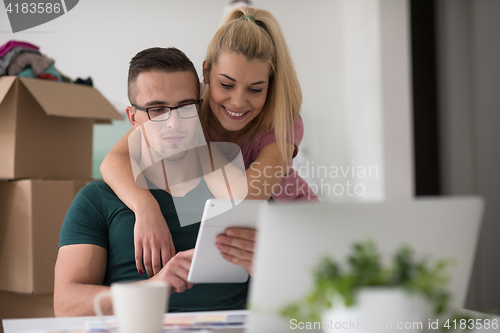 Image of Young couple moving in a new home