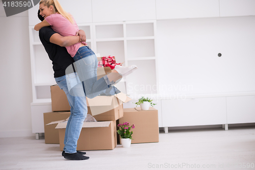 Image of happy Young couple moving in new house