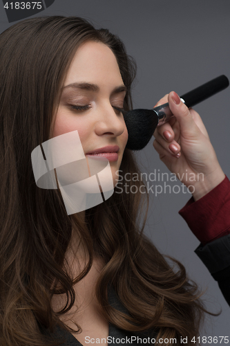 Image of professional makeup artist working