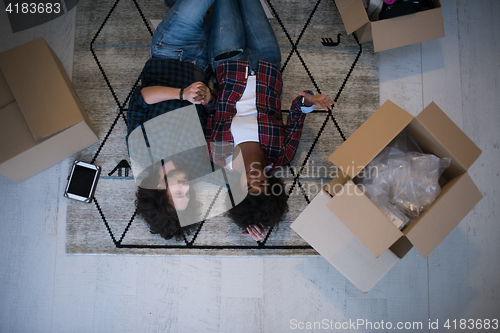 Image of Top view of attractive young multiethnic couple