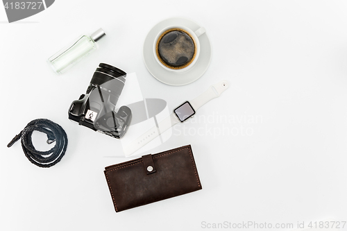 Image of Coffee and personal items on desktop