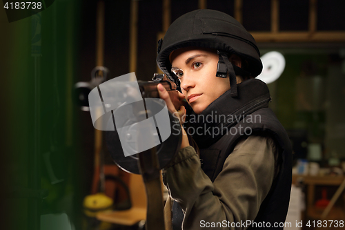 Image of The woman at the shooting range.