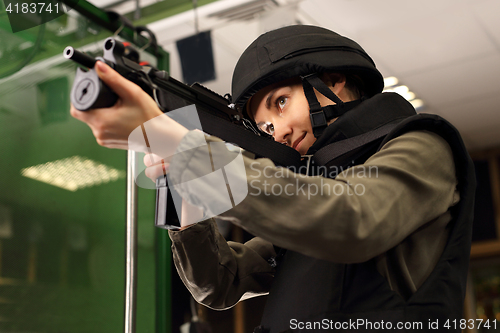 Image of The woman at the shooting range.