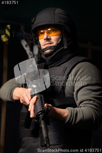 Image of Military exercises on the firing range The soldier fires a rifle at the shooting range Cop shoots a rifle shooting range