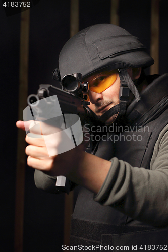 Image of The soldier fires a rifle at the shooting range Cop shoots a rifle shooting range