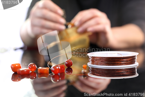 Image of Amber set in silver, beautiful necklace. Workshop jewelery, working on an exclusive jewelry