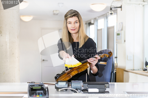 Image of Violinist offering tickets