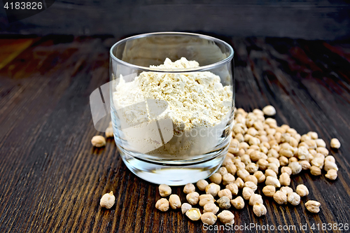 Image of Flour chickpeas in glassful on dark board