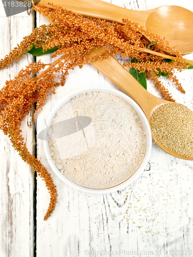 Image of Flour amaranth in white bowl with spoon on board top